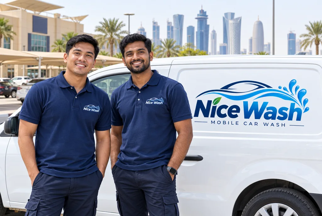 Two smiling NiceWash team members next to the NiceWash van